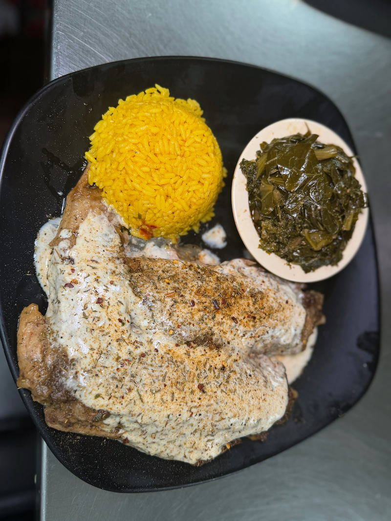 Smothered meat with yellow rice and collard greens