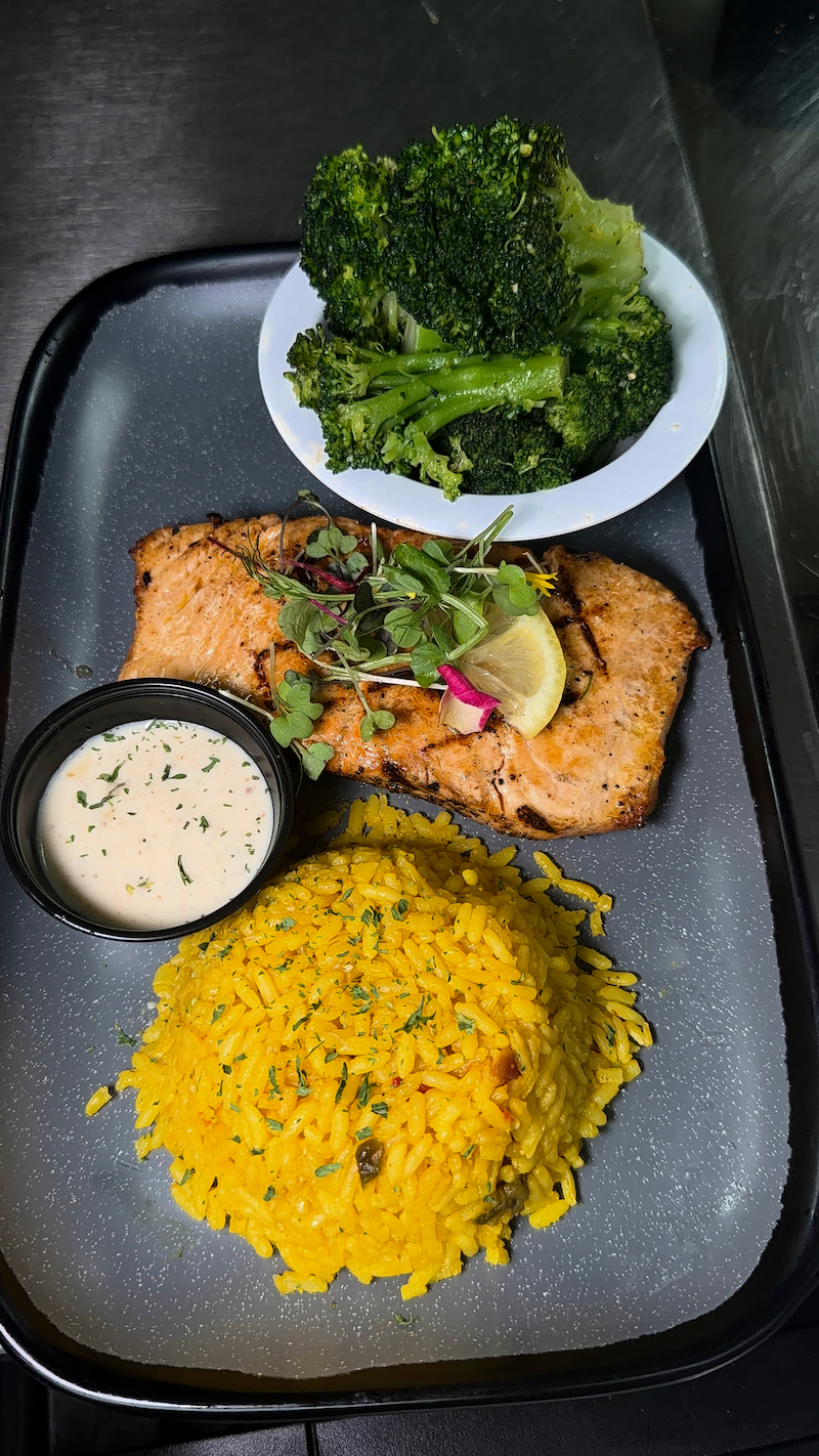 Grilled salmon with yellow rice and broccoli